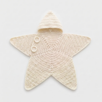 Tiny Starlet Snuggle Star in Creamy Milk - hooded crochet star baby outfit in soft off-white, laid flat